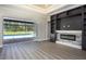 Open living area showcasing fireplace and pool view at 17694 Sw 61St Lane Rd, Dunnellon, FL 34432