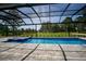 Resort-style pool and spa with screened enclosure and golf course views at 17694 Sw 61St Lane Rd, Dunnellon, FL 34432