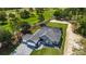 Single-story home with tile roof, pool, and paved driveway at 17694 Sw 61St Lane Rd, Dunnellon, FL 34432