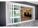 Modern sliding glass doors leading from patio to interior living space at 17694 Sw 61St Lane Rd, Dunnellon, FL 34432