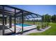 Screened pool enclosure with access to patio and backyard at 17694 Sw 61St Lane Rd, Dunnellon, FL 34432
