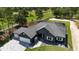 Aerial view of single-story home with pool and golf course views at 17694 Sw 61St Lane Rd, Dunnellon, FL 34432