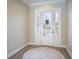 Elegant entryway with a white door and stained glass accents at 17694 Sw 61St Lane Rd, Dunnellon, FL 34432