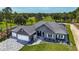 Stunning aerial view of home with attractive landscaping and golf course views at 17694 Sw 61St Lane Rd, Dunnellon, FL 34432