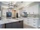 Modern kitchen featuring white cabinets and granite countertops at 17694 Sw 61St Lane Rd, Dunnellon, FL 34432