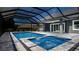Inviting pool and spa area with a screened enclosure at 17694 Sw 61St Lane Rd, Dunnellon, FL 34432