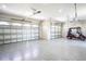 Large garage with epoxy flooring and space for golf cart at 17694 Sw 61St Lane Rd, Dunnellon, FL 34432