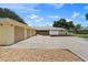 House exterior featuring a three-car garage and a large driveway at 7451 Sadler Rd, Mount Dora, FL 32757