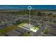 Aerial view of a single-Gathering home in a residential neighborhood at 1157 Torrente Ln, Haines City, FL 33844
