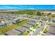 Aerial view of a residential neighborhood near a large field at 1157 Torrente Ln, Haines City, FL 33844