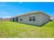 House exterior and grassy backyard at 1157 Torrente Ln, Haines City, FL 33844