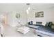 Bright living room features a large sectional sofa and modern coffee table at 1157 Torrente Ln, Haines City, FL 33844