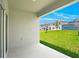 Covered patio overlooking the backyard at 1157 Torrente Ln, Haines City, FL 33844