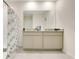 Double sink bathroom with granite countertop and shower at 1157 Torrente Ln, Haines City, FL 33844