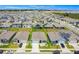 Aerial view of a neighborhood with solar panels on many roofs at 1157 Torrente Ln, Haines City, FL 33844