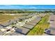 Aerial view of houses near a lake and conservation area at 1157 Torrente Ln, Haines City, FL 33844