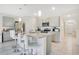 Modern kitchen with stainless steel appliances and granite countertops at 1157 Torrente Ln, Haines City, FL 33844