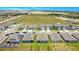 Aerial view of a neighborhood with several houses and streets at 1157 Torrente Ln, Haines City, FL 33844