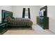 Comfortable bedroom with black bed frame and dresser at 1157 Torrente Ln, Haines City, FL 33844