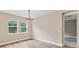 Bright dining room featuring hardwood floors and a chandelier at 352 Birkdale Dr, Daytona Beach, FL 32124