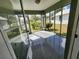 Spacious screened porch with concrete flooring at 645 W 6Th St, Lakeland, FL 33805