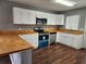Renovated kitchen with butcher block countertops at 645 W 6Th St, Lakeland, FL 33805