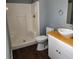 Clean bathroom with corner shower, wood-look floors, and modern vanity at 645 W 6Th St, Lakeland, FL 33805