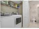 Convenient laundry room with washer, dryer, and storage at 5300 S Atlantic Ave # 15-403, New Smyrna Beach, FL 32169