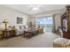 Living room with sliding doors that open to a balcony and scenic view at 5300 S Atlantic Ave # 15-403, New Smyrna Beach, FL 32169