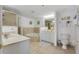 Bathroom with double vanity, soaking tub, and shower at 5300 S Atlantic Ave # 15-403, New Smyrna Beach, FL 32169