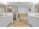 Large bathroom with double vanity, soaking tub, and separate shower at 5300 S Atlantic Ave # 15-403, New Smyrna Beach, FL 32169