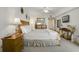 King-size bed in a well-lit bedroom with ocean views at 5300 S Atlantic Ave # 15-403, New Smyrna Beach, FL 32169