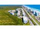 Aerial view of community near ocean, highlighting location and buildings at 5300 S Atlantic Ave # 15-403, New Smyrna Beach, FL 32169