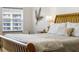 Close-up of a king-size bed in a well-lit bedroom at 5300 S Atlantic Ave # 15-403, New Smyrna Beach, FL 32169