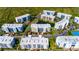 Aerial perspective showcasing community layout and pond at 5300 S Atlantic Ave # 15-403, New Smyrna Beach, FL 32169
