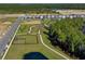 Aerial view of new homes, park with dog park, and lake at 16217 Honey Harvest St, Winter Garden, FL 34787