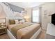 Bedroom with a king-size bed and abstract wall art at 3982 Lana Ave, Davenport, FL 33897