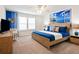 Beach themed bedroom with a king-size bed and ocean mural at 3982 Lana Ave, Davenport, FL 33897