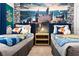 Twin bedroom with Hogwarts theme and owl plushies at 3982 Lana Ave, Davenport, FL 33897