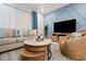 Living area featuring a sectional sofa and coastal decor at 3982 Lana Ave, Davenport, FL 33897