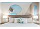 Relaxing bedroom with a king bed and beach mural at 3982 Lana Ave, Davenport, FL 33897