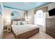 Beach-themed bedroom with a king-size bed and calming decor at 3982 Lana Ave, Davenport, FL 33897