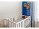 Bedroom with a crib and Mickey Mouse decor at 3982 Lana Ave, Davenport, FL 33897
