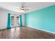 Bright bedroom with laminate flooring and sliding glass doors at 2715 Autumn Green Dr, Orlando, FL 32822