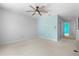 Spacious bedroom with ceiling fan and light blue accent wall at 2715 Autumn Green Dr, Orlando, FL 32822