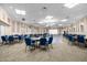 Large community room with tables and chairs, perfect for events at 2715 Autumn Green Dr, Orlando, FL 32822