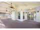 Bright sunroom with multiple windows and ceiling fans at 2715 Autumn Green Dr, Orlando, FL 32822