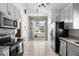 Bright kitchen featuring stainless steel appliances and backyard view at 2715 Autumn Green Dr, Orlando, FL 32822