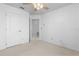 Bedroom with ceiling fan and access to hallway at 2715 Autumn Green Dr, Orlando, FL 32822