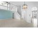 Open living room with high ceilings, light walls, and tile floors at 2715 Autumn Green Dr, Orlando, FL 32822
